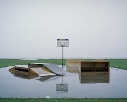 The sky becomes the sea, behind a recreation area at Carter’s Beach, west of Westport. With one concrete slab surrounded by rain-swamped grassed land, skate ramps share a space with a basketball hoop.