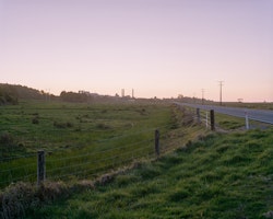 With the Tasman sea to the right of the frame, the sun sets behind the chimneys of Holcim’s closed Cape Foulwind Cement Plant. A $250 million waste to energy plant proposed for the site would burn rubbish collected from around the South Island. It has been said that the plant could be the key to reviving the West Coast economy.