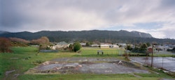 Mountain-like forms are reflected in the skate park from the Rapahoe Range in the distance. With the surrounding area in a state of disrepair, what is here for children? Runanga’s main employer is coal mining, yet with the next generation leaving as quickly as possible, what would convince them stay?