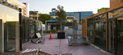 During initial demolition stages in preparation for new, permanent development. Towards Justice Precinct.